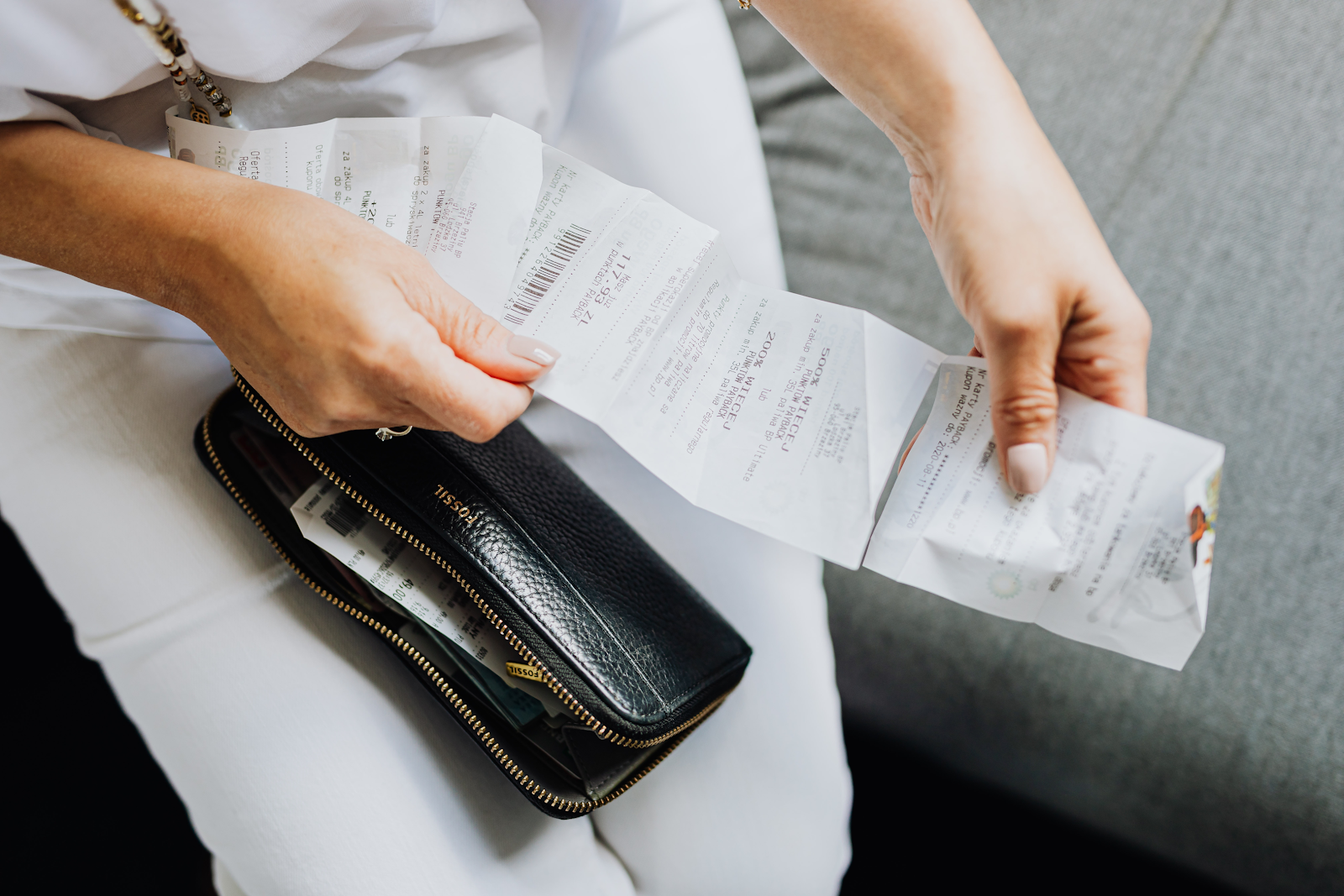 A Receipt Example Being Hold by a Women